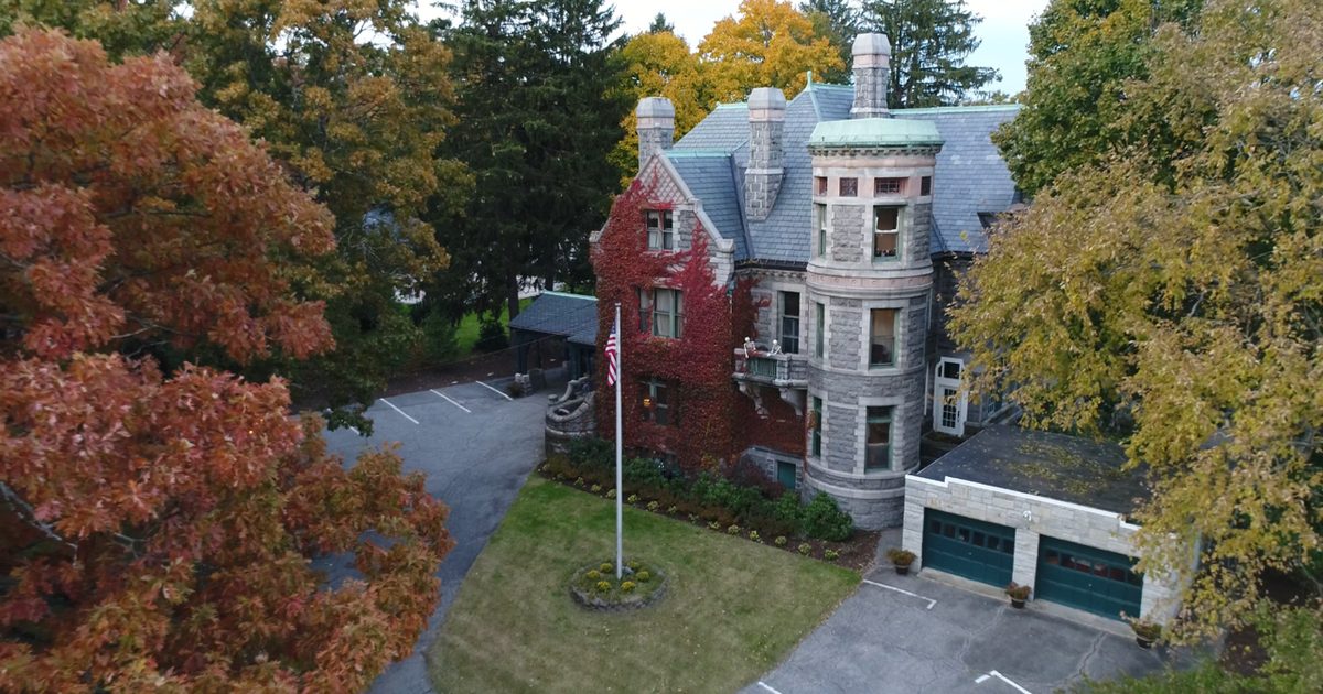 Aerial view of the house in autumn with the flag flying