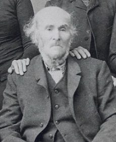 Allen Perry in old age, seated, from a family group photograph