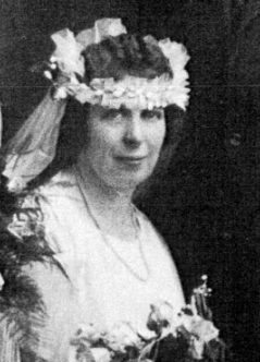 Carolyn Bronson Chaffee seated in her wedding veil and floral crown