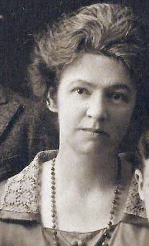 Grace Ridall Chaffee wearing a long bead necklace, from a family portrait