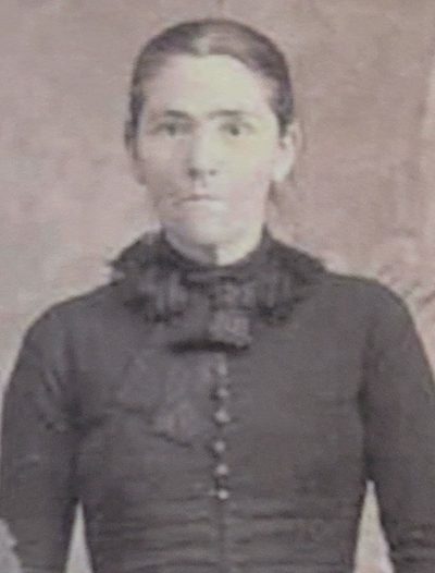 Nancy Perry Bickford standing in a dark buttoned dress, from a family cabinet card