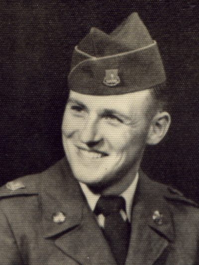 Vivian Francis Perry smiling in his Army uniform and garrison cap