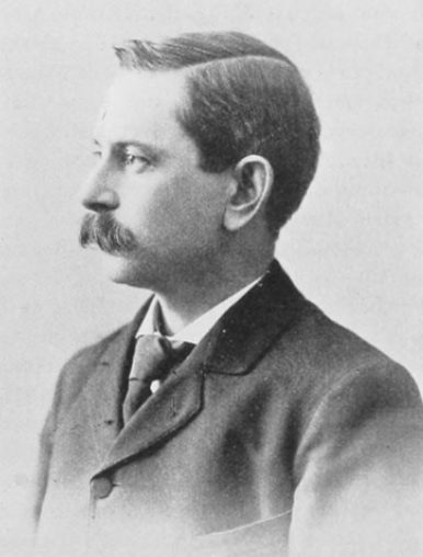 Engraved portrait of a man with short side-parted hair and a mustache, in a dark coat, in profile