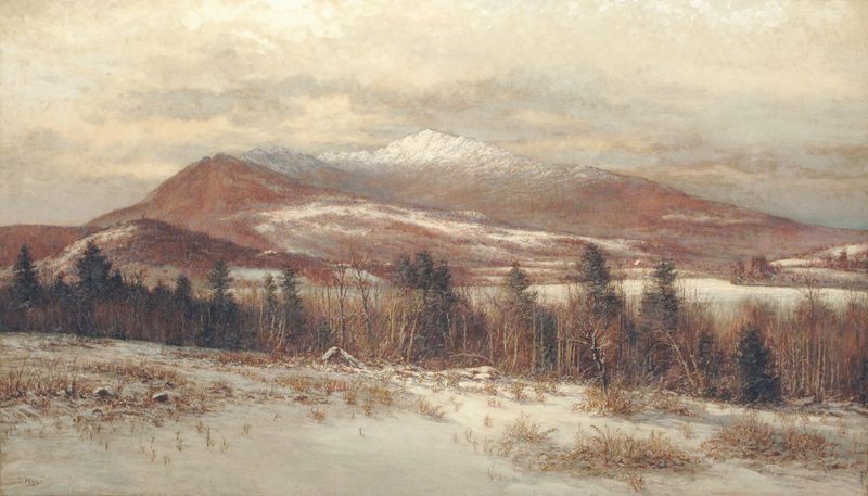 Mount Monadnock under snow, seen across wooded hills in winter light