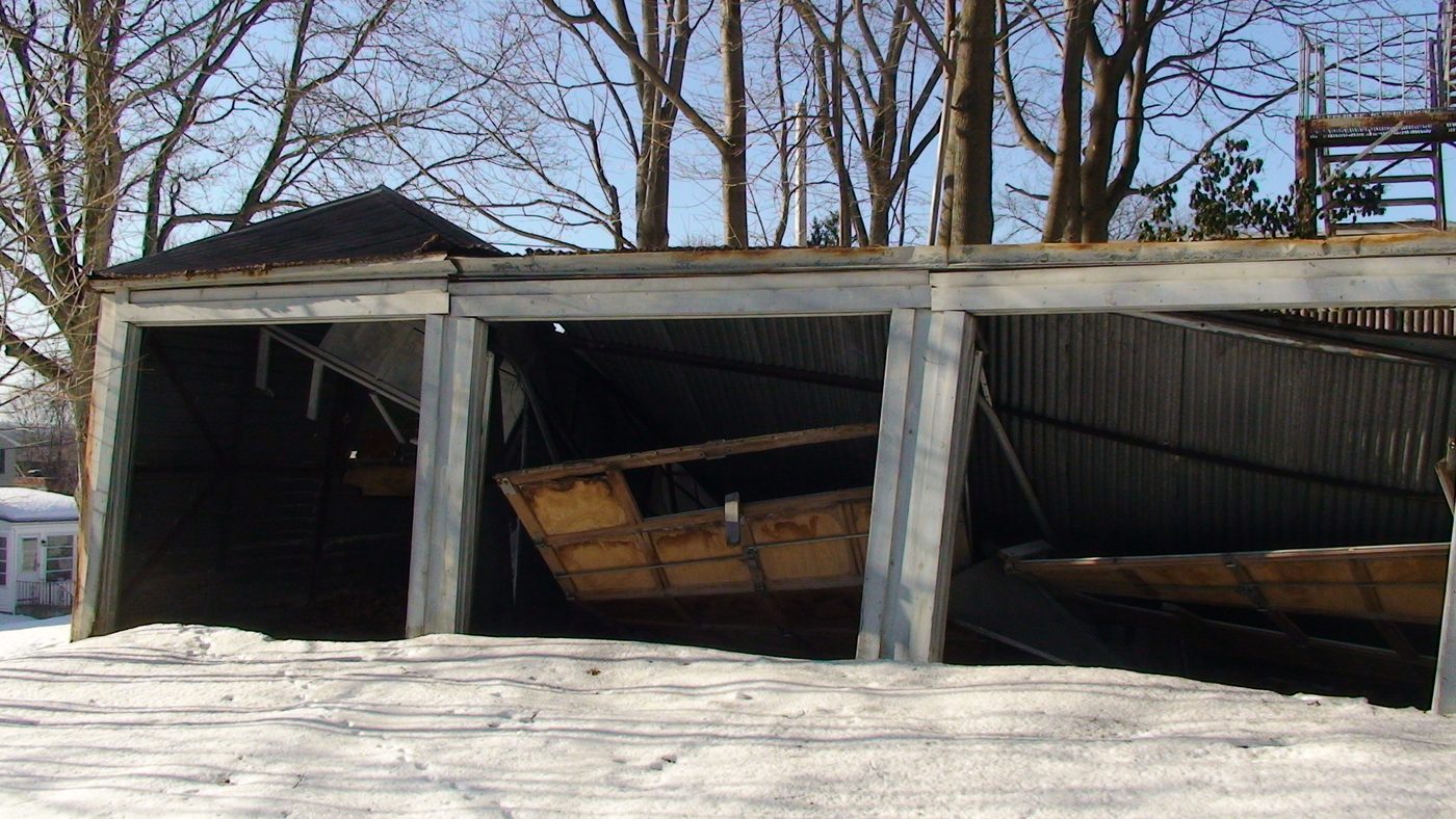 The collapsed roof of the concrete garage