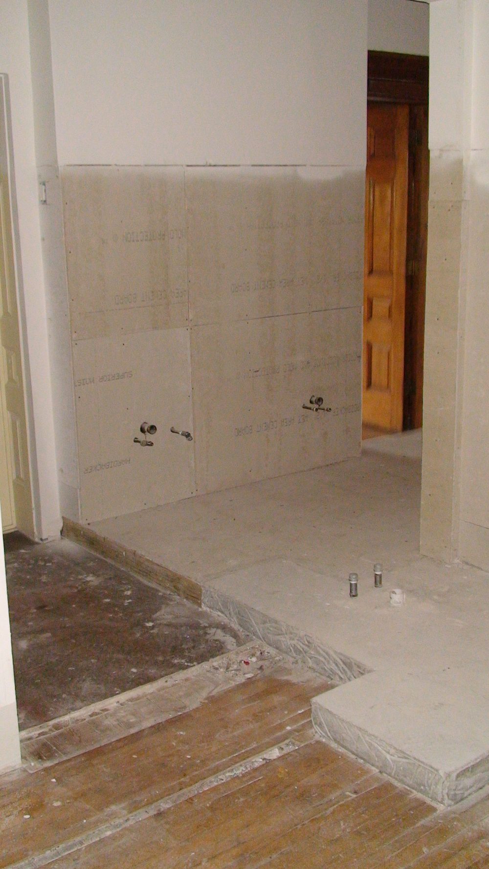 A stripped interior wall with fixtures removed