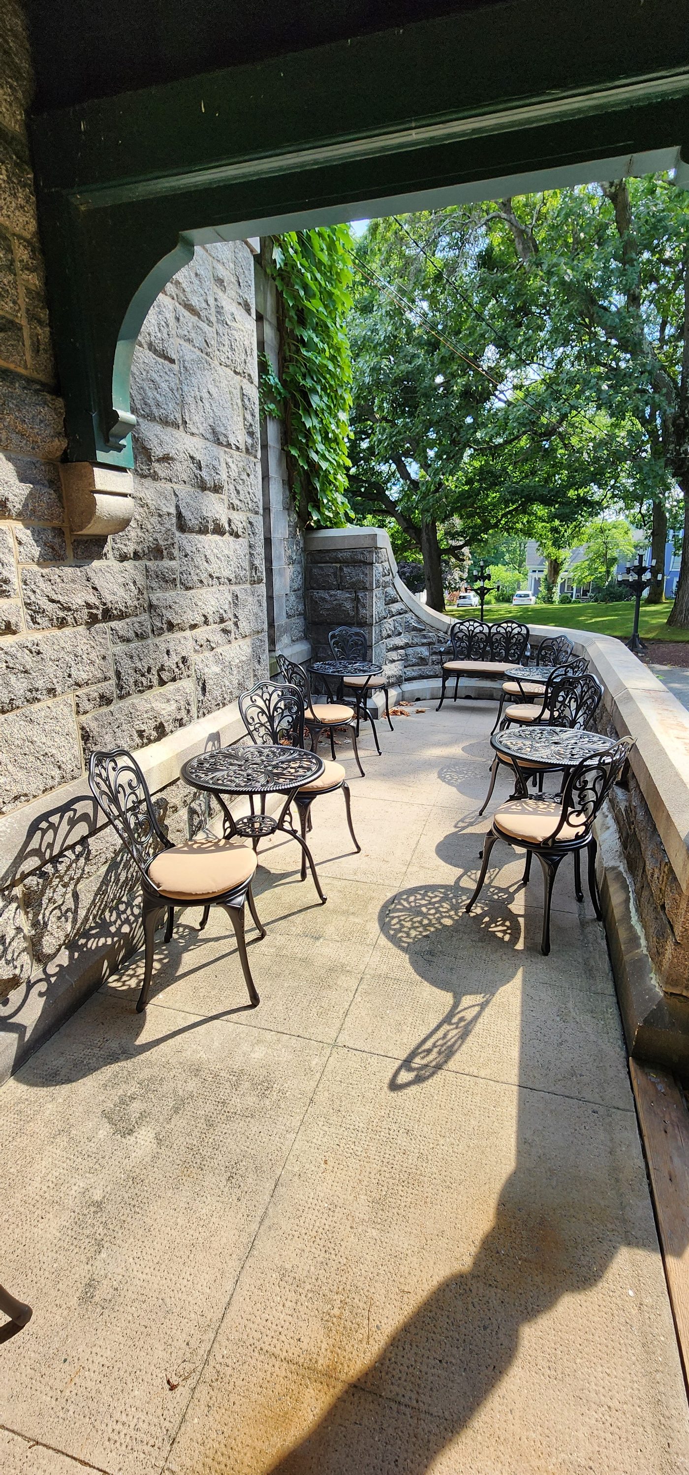 Terrace seating beside the stone wall