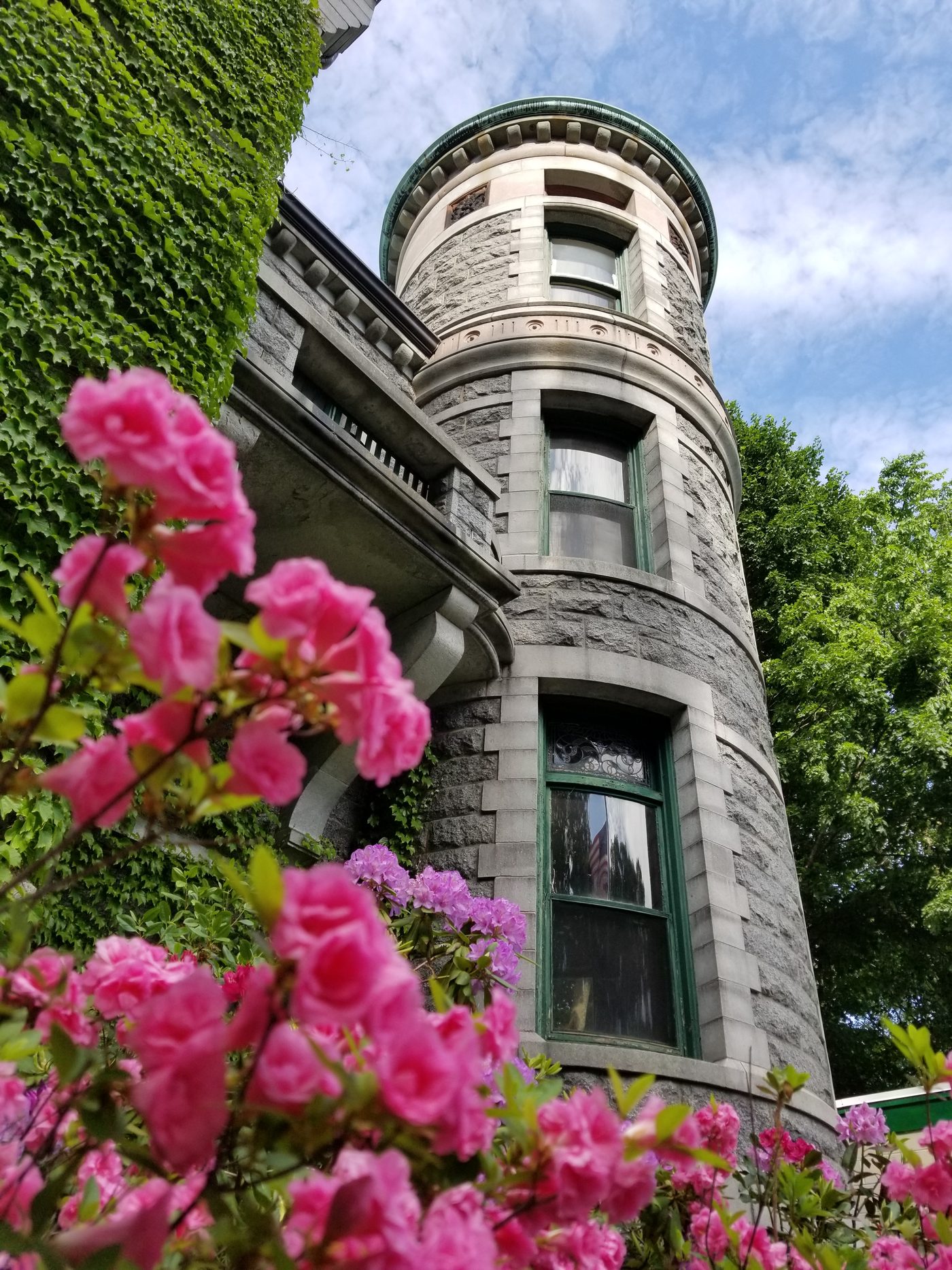 The round tower behind pink blossom