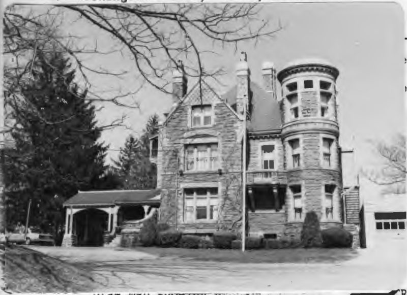 Black-and-white survey photograph of the house from the street