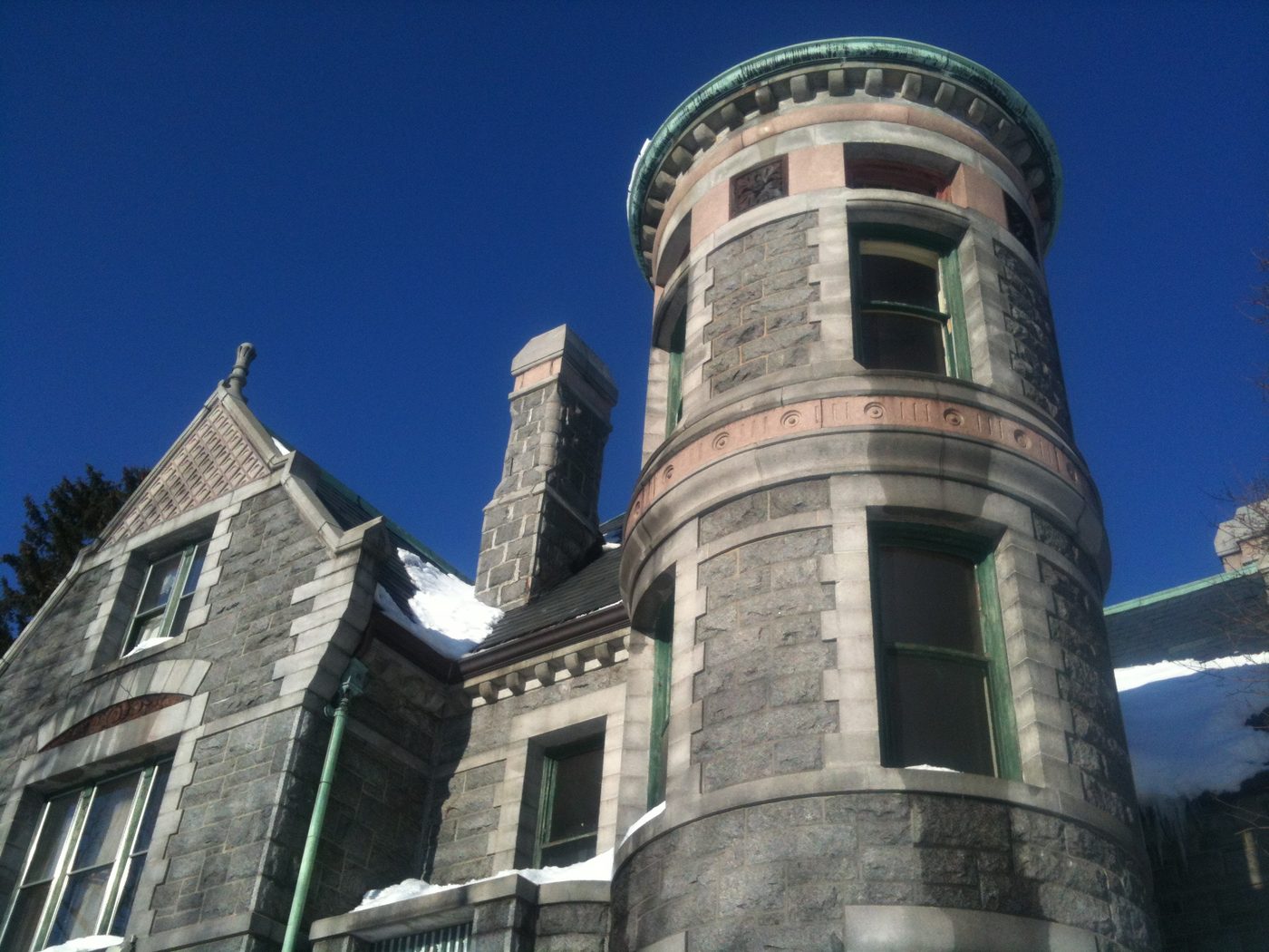 The round tower and chimneys against a blue sky