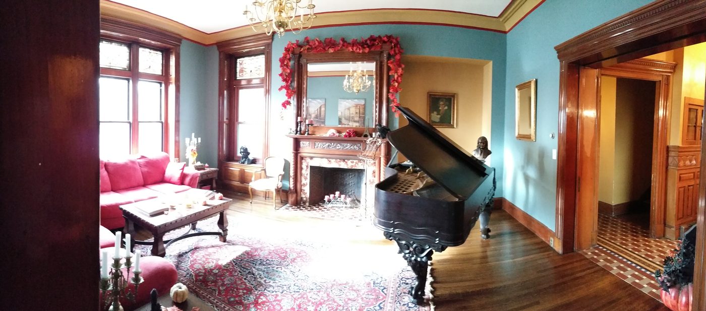 The music room with a grand piano in autumn light